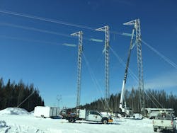 Three-mast guyed deadend structure installation. Three-mast guyed deadend structure installation.