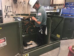 An Emerald Transformer technician repairs a transformer. Emerald is building a facility in Waco, Texas to respond to the new demand for transformer services.