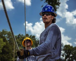 Students who served in the U.S. military are honored with custom-made veteran hardhats at Southeast Lineman Training Center. Students who served in the U.S. military are honored with custom-made veteran hardhats at Southeast Lineman Training Center.