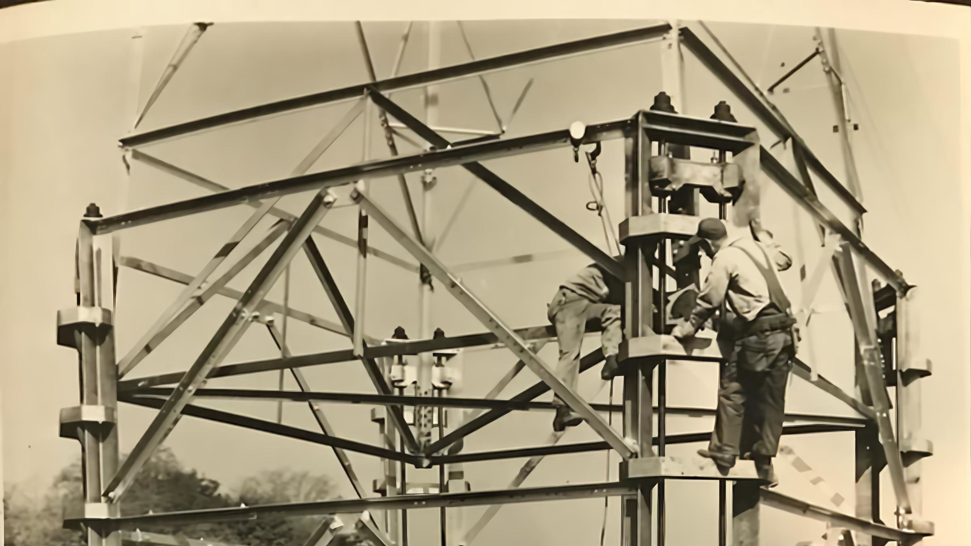 In the early days, lineworkers erected a lattice tower without the heavy equipment line crew have access to today.