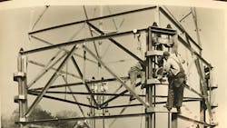 In the early days, lineworkers erected a lattice tower without the heavy equipment line crew have access to today. In the early days, lineworkers erected a lattice tower without the heavy equipment line crew have access to today.