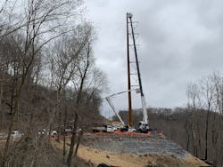 The lineworkers are erecting new weathered steel monopoles to replace century-old lattice steel towers. The lineworkers are erecting new weathered steel monopoles to replace century-old lattice steel towers.