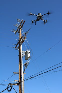 A drone conducts a comprehensive asset inspection on distribution lines and equipment. A drone conducts a comprehensive asset inspection on distribution lines and equipment.