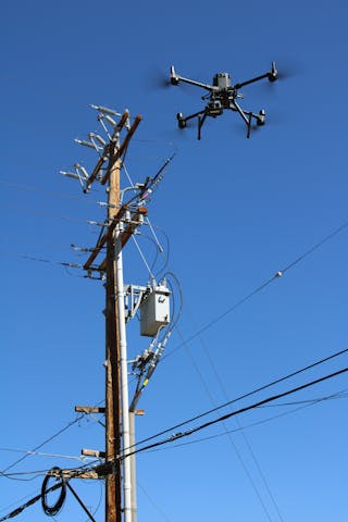 A drone conducts a comprehensive asset inspection on distribution lines and equipment.
