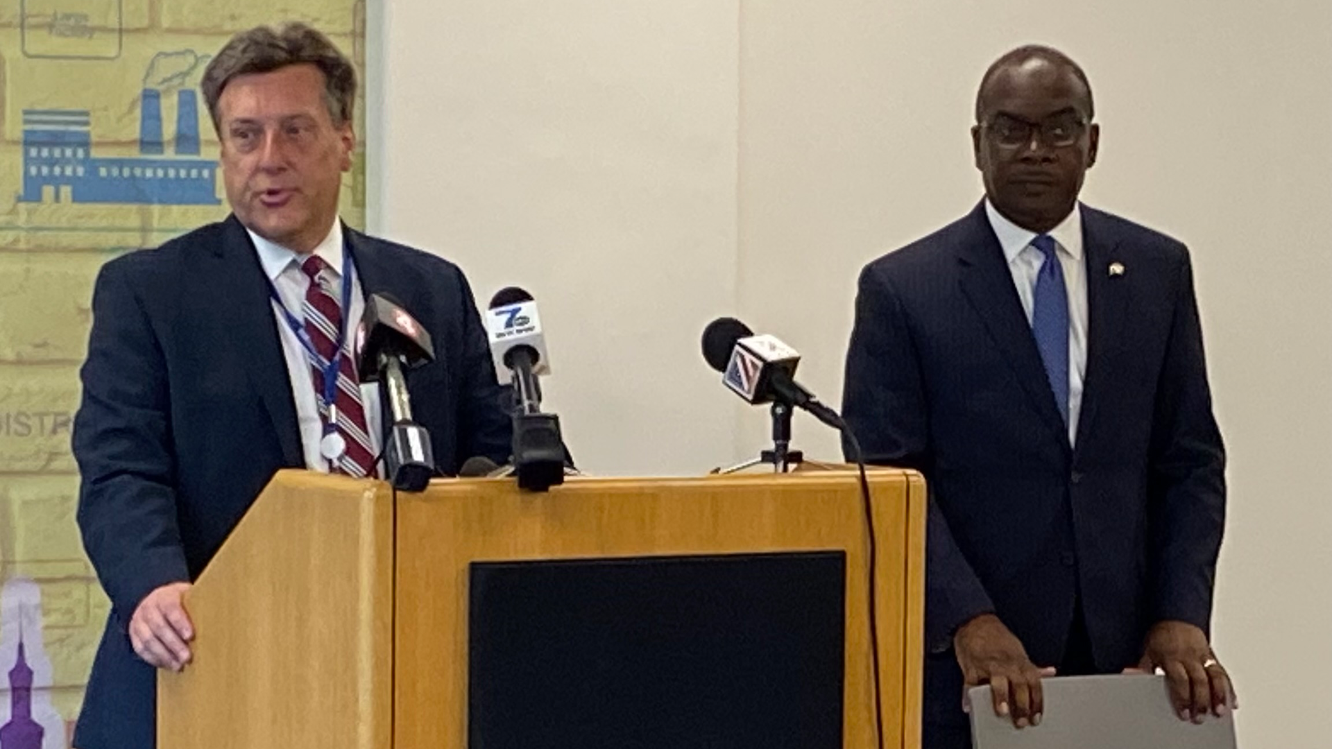 National Grid Regional Director Ken Kujawa, (left), introduces Buffalo Mayor Byron Brown (right) at the Aug. 8 kickoff event.