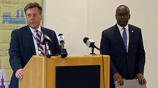 National Grid Regional Director Ken Kujawa, (left), introduces Buffalo Mayor Byron Brown (right) at the Aug. 8 kickoff event.