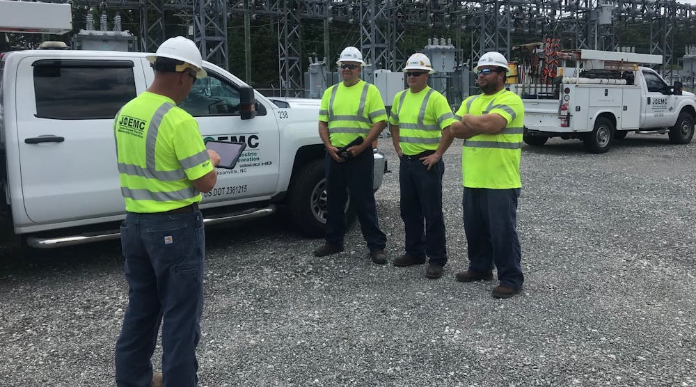 Line workers with JOEMC reviewing the safety job briefing on the eSMART platform before work begins. To ensure substations are carefully managed, the coop employs a substation supervisor who oversees two substation crew leaders, each managing three line workers with expertise ranging from apprentice to journeyman.
