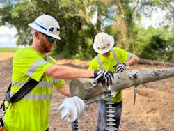 Line workers with Jones-Onslow Electric Membership Corporation perform some pole-top work before the pole is put in place. JOEMC takes transmission delivery from Duke Energy Corp. to feed its transmission and substation network, which supplies 32 distribution substations. Line workers with Jones-Onslow Electric Membership Corporation perform some pole-top work before the pole is put in place. JOEMC takes transmission delivery from Duke Energy Corp. to feed its transmission and substation network, which supplies 32 distribution substations.