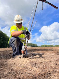 A JOEMC line worker works on a guy wire attachment. Safety training is crucial to protecting utility workers, and the co-op utility was looking for a way to streamline training.