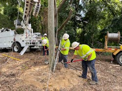 JOEMC workers put a utility pole into place. The co-op employs 183 people, about 90 of whom account for outside line workers who handle a myriad of tasks, including vegetation management and line construction and maintenance. JOEMC workers put a utility pole into place. The co-op employs 183 people, about 90 of whom account for outside line workers who handle a myriad of tasks, including vegetation management and line construction and maintenance.