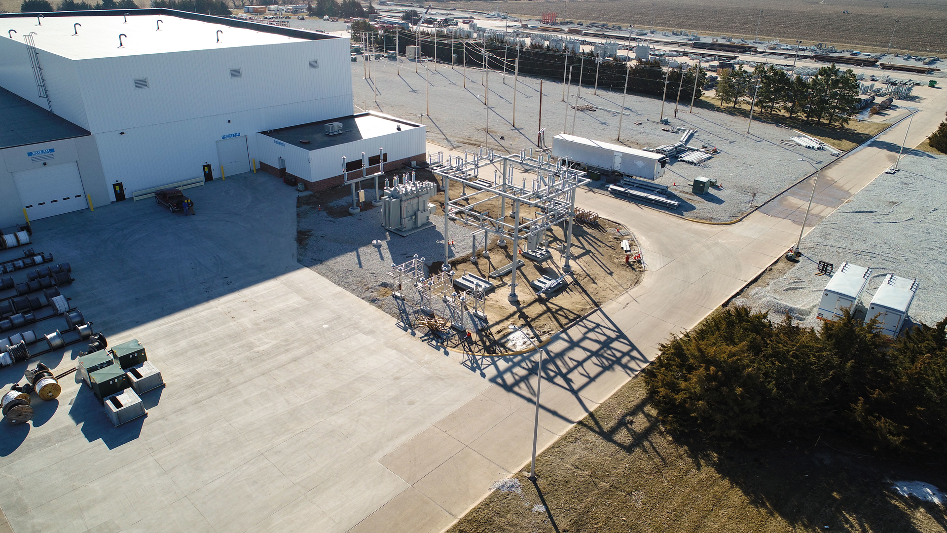 Just west of the new training facility (top left) sits a 115kV substation (shown here during construction) that is used for training technicians. Parts from this substation can be used to replace parts on equipment out in the field if needed.