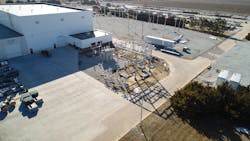 Just west of the new training facility (top left) sits a 115kV substation (shown here during construction) that is used for training technicians. Parts from this substation can be used to replace parts on equipment out in the field if needed. Just west of the new training facility (top left) sits a 115kV substation (shown here during construction) that is used for training technicians. Parts from this substation can be used to replace parts on equipment out in the field if needed.