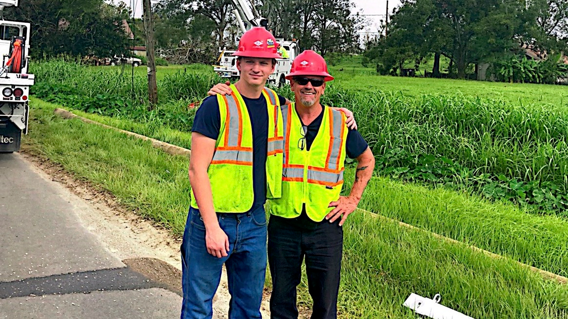 Wayne Lynn, and his son, William, are shown on a storm restoration in Louisiana in September 2021.