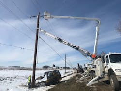 Crews work to replace poles following Winter Storm Wesley in 2019.