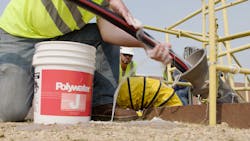 Underground cable is fed into a conduit pipe. Underground cable is fed into a conduit pipe.