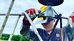 Christopher Frazier, an apprentice for Davis H. Elliot, says he enjoys his job in the line trade and can’t imagine doing anything else for a career. Christopher Frazier, an apprentice for Davis H. Elliot, says he enjoys his job in the line trade and can’t imagine doing anything else for a career.