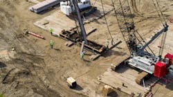 The foundation design consisted of four pile caps, one for each tower leg, containing 30 concrete piles — 65-ft (20-m) long, driven at a battered angle and tied together by a concrete strap beam. The foundation design consisted of four pile caps, one for each tower leg, containing 30 concrete piles — 65-ft (20-m) long, driven at a battered angle and tied together by a concrete strap beam.