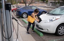 Kaedi Sanchez plugs in her car at a City of Albuquerque electric vehicle charger before heading to work. Sandia National Laboratories researchers have been studying the vulnerabilities of electric vehicle charging infrastructure, including public chargers, to better inform policymakers.
