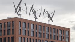 Vertical axis wind turbines arrayed on a piece of commercial real estate in Germany.