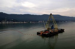 Vessel laying submarine cable. Vessel laying submarine cable.