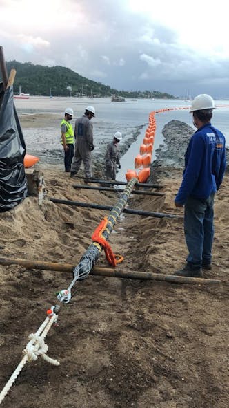 Submarine cable launch on the island beach in the channel between the continent and island.