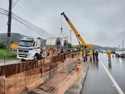 Underground cable reels being unloaded beside the trench. Underground cable reels being unloaded beside the trench.