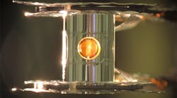 A metallic case called a hohlraum holds the fuel capsule for NIF experiments. Target handling systems precisely position the target and freeze it to cryogenic temperatures (18 kelvins, or -427 degrees Fahrenheit) so that a fusion reaction is more easily achieved.