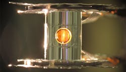 A metallic case called a hohlraum holds the fuel capsule for NIF experiments. Target handling systems precisely position the target and freeze it to cryogenic temperatures (18 kelvins, or -427 degrees Fahrenheit) so that a fusion reaction is more easily achieved. A metallic case called a hohlraum holds the fuel capsule for NIF experiments. Target handling systems precisely position the target and freeze it to cryogenic temperatures (18 kelvins, or -427 degrees Fahrenheit) so that a fusion reaction is more easily achieved.
