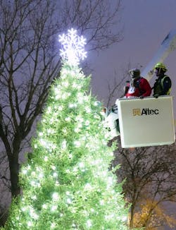 East St. Louis Mayor Robert Eastern III plugs in the star on top of the Christmas tree in the City with the assistance of Ameren Illinois Journeyman Lineman Josh Daniels. Ameren Illinois donated the LED holiday lights for the tree and then gave Eastern a lift in a double bucket truck to officially kick off the Christmas season in the City. East St. Louis Mayor Robert Eastern III plugs in the star on top of the Christmas tree in the City with the assistance of Ameren Illinois Journeyman Lineman Josh Daniels. Ameren Illinois donated the LED holiday lights for the tree and then gave Eastern a lift in a double bucket truck to officially kick off the Christmas season in the City.