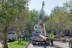 Heavy equipment delivers new distribution poles to workers performing outage restoration. Having a centralized tool with standardized processes for each project team to contribute to and work from helps create a clear picture of project progress and allows issues to be elevated efficiently and in a timely manner.