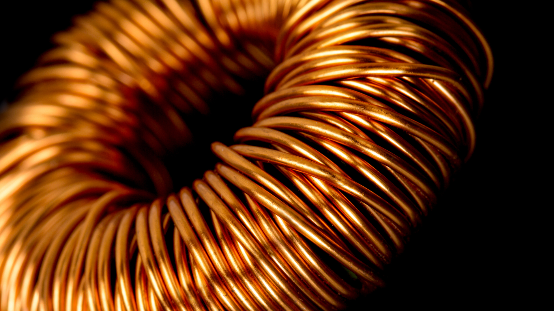 Copper twined around the core of a transformer.