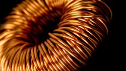 Copper twined around the core of a transformer. Copper twined around the core of a transformer.