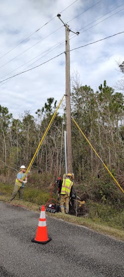 Osmose crews installing a Tough Truss Extra to restore and strengthen a pole as part of a resiliency program Photo by Osmose.
