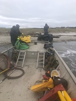 Dominion Energy South Carolina crew members unload gear and materials on Dewees Island. Dominion Energy South Carolina crew members unload gear and materials on Dewees Island.