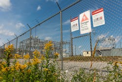 Warning signs at a substation in Quebec, Canada, announce the dangers within in both French and English.