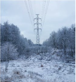 A Finnish winter scene with a transmission pylon tower. The automation completed to date, has improved Helen&rsquo;s system interruption duration index (SAIDI) by reducing the interruption about 0.5 minutes per annum.