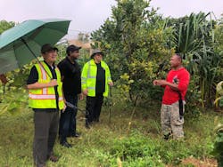 Outplants of nursery-raised trees (Serianthes nelsonii) with officials of the Guam Plant Extinction Prevention Program (GPEPP).