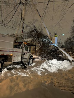 A Lewis crew works in single-digit temperatures at night after Winter Storm Elliott. A Lewis crew works in single-digit temperatures at night after Winter Storm Elliott.