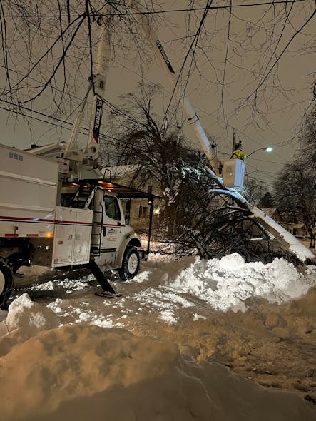 A Lewis crew works in single-digit temperatures at night after Winter Storm Elliott.