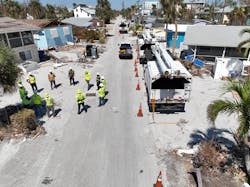 This drone photo shows Lewis crews conducting pre-job safety briefing in Fort Myers, Florida, before starting day of restoration work following Hurricane Ian. This drone photo shows Lewis crews conducting pre-job safety briefing in Fort Myers, Florida, before starting day of restoration work following Hurricane Ian.