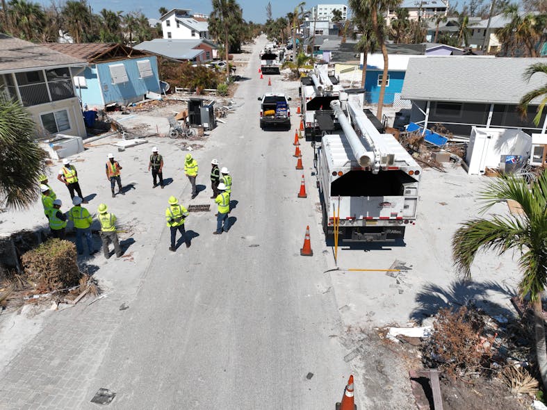 This drone photo shows Lewis crews conducting pre-job safety briefing in Fort Myers, Florida, before starting day of restoration work following Hurricane Ian.