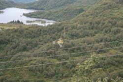 Robot installing AWM above live-phase conductors using ZECK-pulling robot to measure distance between AWMs and act as visual aid for helicopter pilot. Robot installing AWM above live-phase conductors using ZECK-pulling robot to measure distance between AWMs and act as visual aid for helicopter pilot.