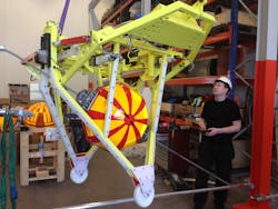 Innova technician Tore Serigstad uses robot to install marker on transmission line with 300 slope during factory testing. Innova technician Tore Serigstad uses robot to install marker on transmission line with 300 slope during factory testing.