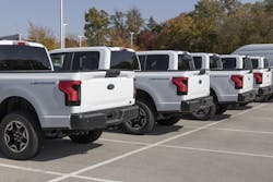 A row of Ford F-150 Lightning all-electric pickups are for sale. A greater variety of EVs models capable of doing different jobs is driving growth in the electric fleet sector for commercial, industrial and institutional electricity customers.