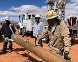 With Monument Valley as a backdrop, Greenville Utilities crews worked to extend a power line that will serve 24 Navajo families. With Monument Valley as a backdrop, Greenville Utilities crews worked to extend a power line that will serve 24 Navajo families.