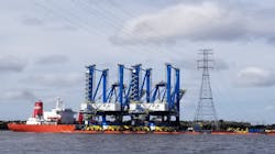 New Neo-Panamax cranes passing under the transmission line crossing. New Neo-Panamax cranes passing under the transmission line crossing.