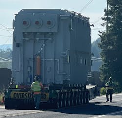 A heavy-haul truck and trailer carried the 450,000 lb. transformer to its final destination. A heavy-haul truck and trailer carried the 450,000 lb. transformer to its final destination.