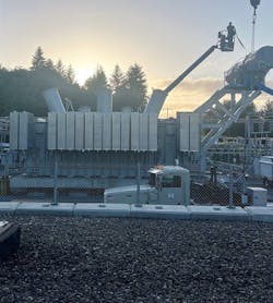 After PSE crews installed the radiators and conservator tank, three bushings were mounted on the transformer. After PSE crews installed the radiators and conservator tank, three bushings were mounted on the transformer.