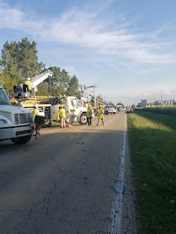 Crews replace poles as part of an outage response effort led by ComEd. Crews replace poles as part of an outage response effort led by ComEd.