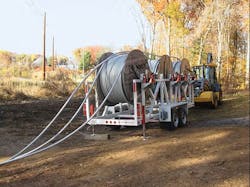 Reels of 69-kV spacer cable ready to be strung. Reels of 69-kV spacer cable ready to be strung.